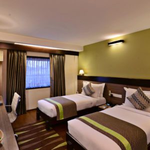 Guest room at Leisure Inn Grand Chanakya